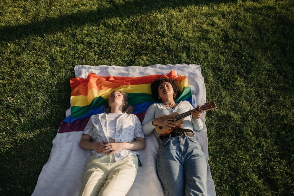 non binary couple on a Picnic Blanket Together