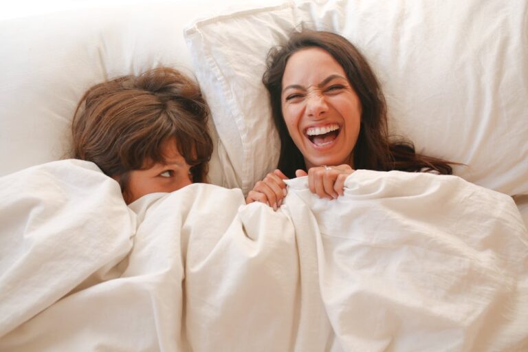 queer Couple lying on Bed